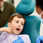 Child Pointing at a Tooth